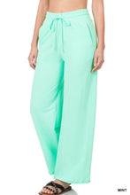 Load image into Gallery viewer, FRENCH TERRY DRAWSTRING WAIST RAW EDGE HEM PANTS